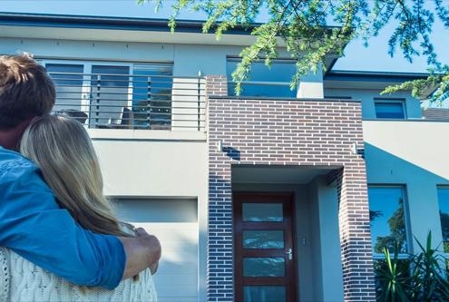 Family admiring new home Family admiring new home